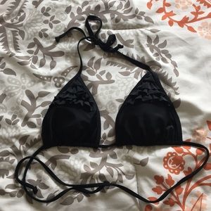 Ruffled black swimsuit top